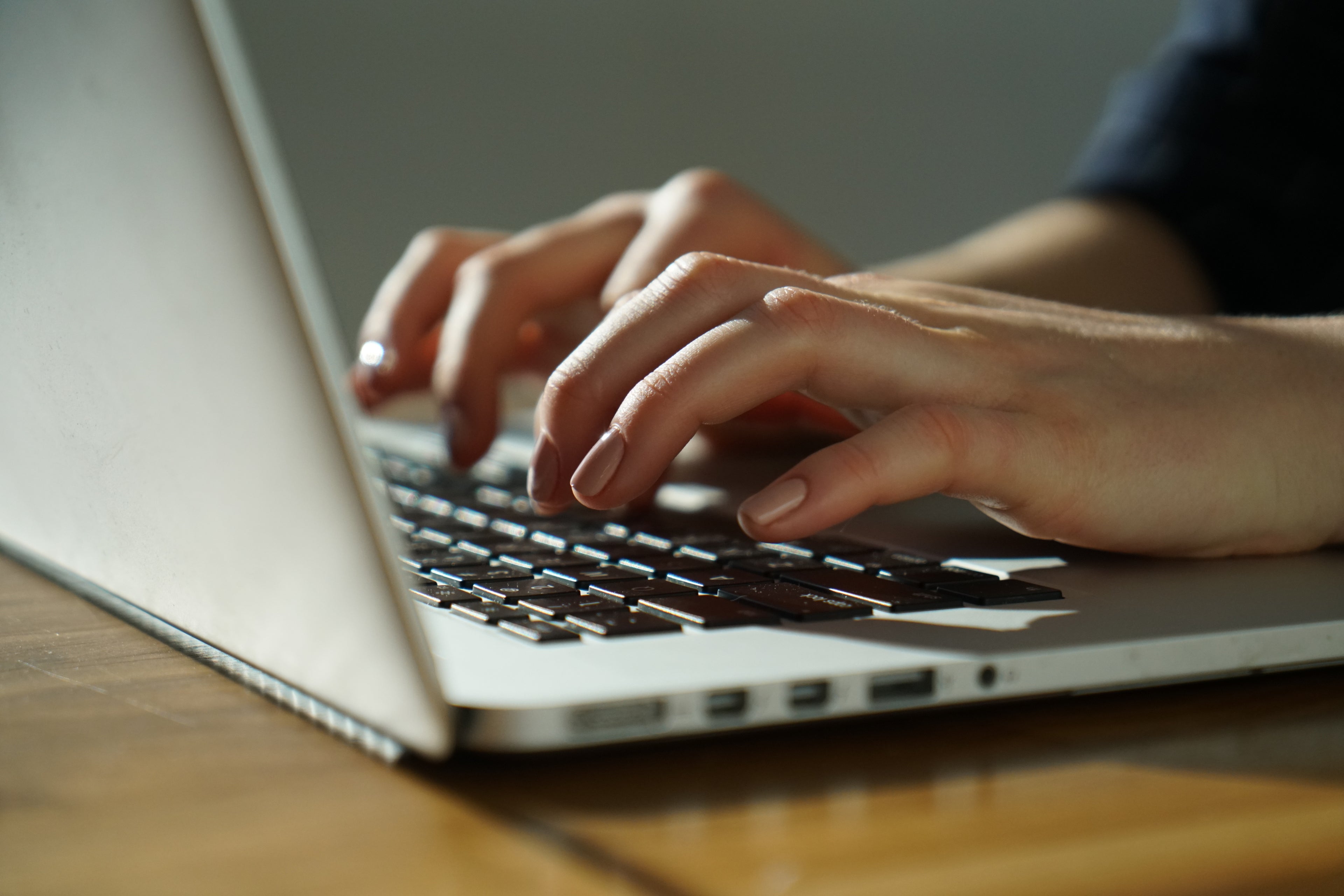 handstyping on laptop keyboard